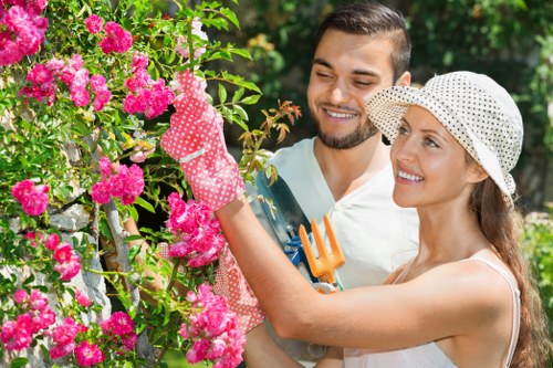 Shaded garden lawn care in Turnpike Lane with green grass and soil treatment
